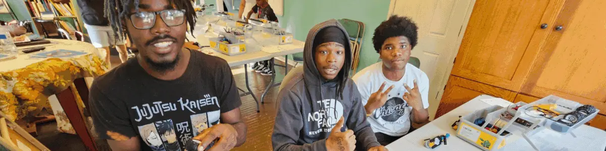 A club leader and students at work on a project