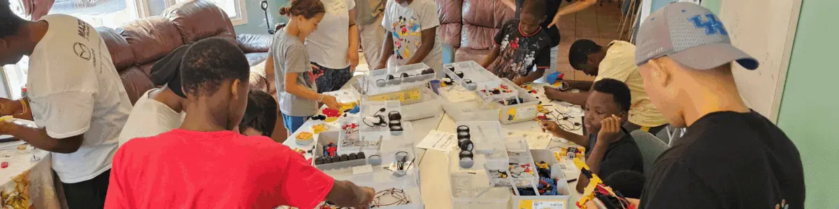 Students sorting parts for a building project